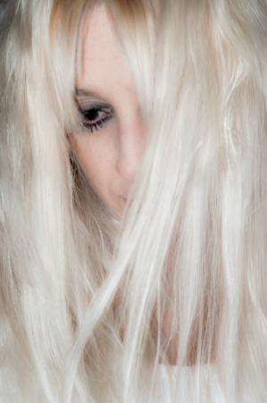 A worrying blonde beautiful girlの写真素材