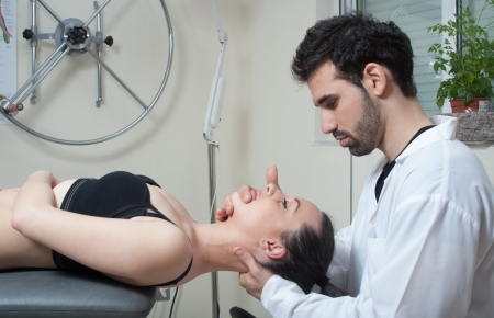 Manual, physio and kinesio therapy techniques performed by a male physiotherapist on a training...