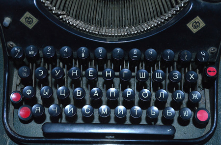 Old black typewriter with white lettersの写真素材