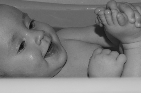Cute child smiling in black and whiteの写真素材