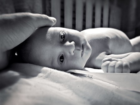 The hand of the father touches the babyの写真素材