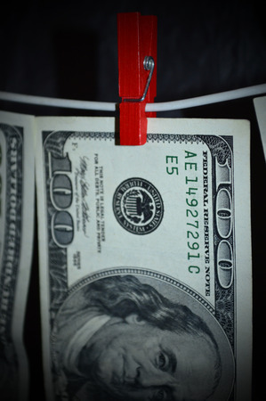 100 dollars dry on the clotheslineの写真素材