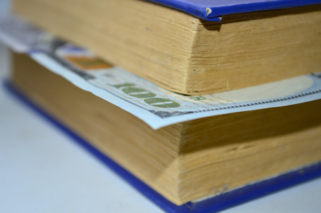 Book with a bookmark from dollarsの写真素材