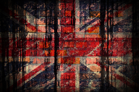 Flag of America on a brick wall with stains of black paintの写真素材