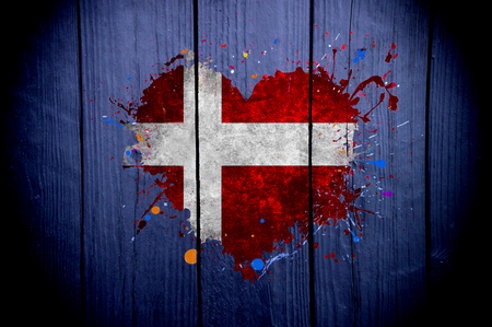 Flag of Denmark in the shape of heart on a dark backgroundの写真素材
