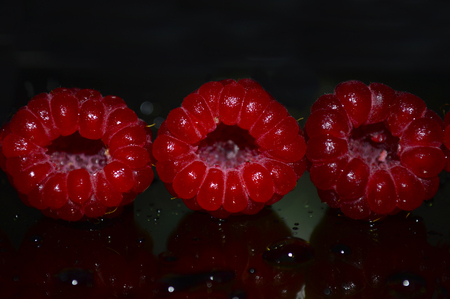 Beautiful raspberry berry with water drops
