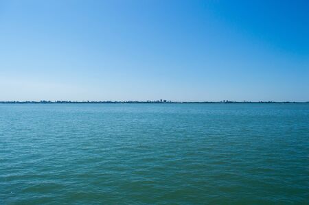 City silhouette on the sea horizon in detail