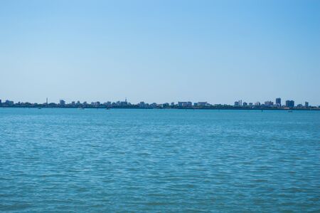 City silhouette on the sea horizon in detail