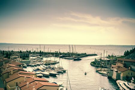 Beautiful promenade with houses and a marina in detailの写真素材