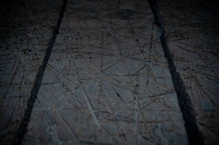 Old boards with saw marks and scratches close up