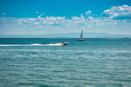 One sailboat is sailing in the sea close upの写真素材