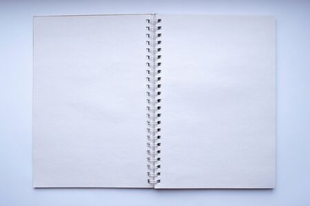 Notebook binding with white blank sheet in detail