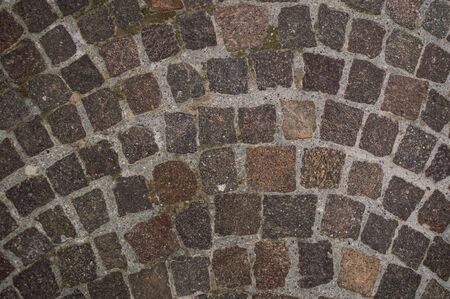 The road with old paving stones close up