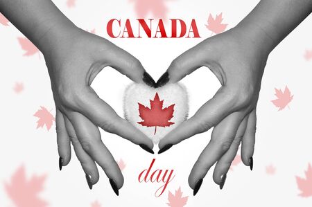 Hands holding heart with flag of Canada.の写真素材