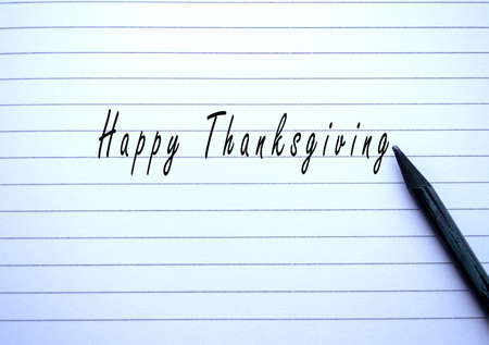 Happy thanksgiving lettering on paper close upの写真素材