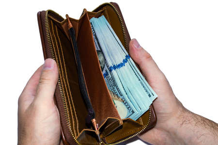 An open wallet with a lot of money close up