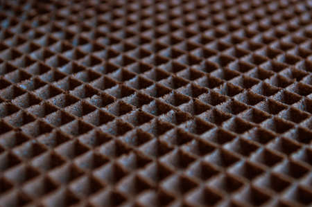 Empty brown waffle texture close up, background for your designの写真素材