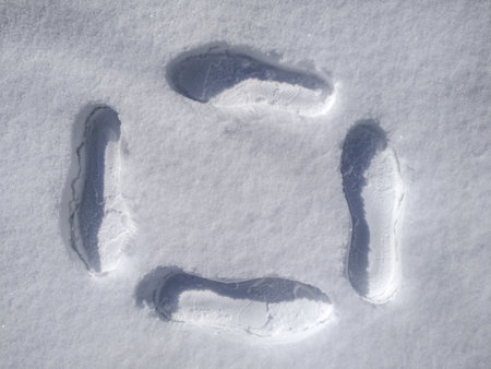 Shoe prints in the snow close up