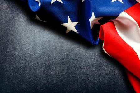 American flag on rough dark surface close upの写真素材