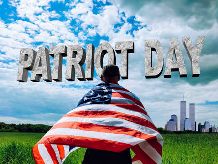 Patriot Day. The flag of America on the shoulders of a man against the backdrop of the Twin Towers...