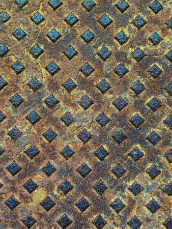 The texture of the old metal with a pattern of cubes in detail.の写真素材
