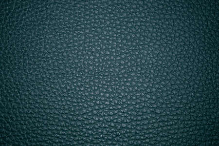 Background of artificial leather in dark color close up.