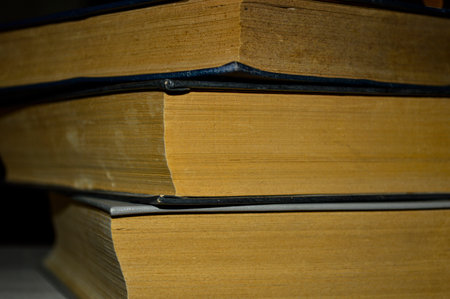 Stack of old books close up in detail.