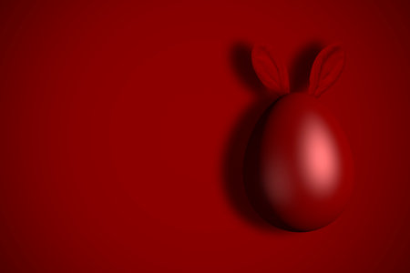 Red Easter egg with bunny ears close up.の写真素材