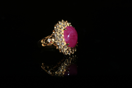 Jewellery diamond ring and gemstone on a black backgroundの写真素材