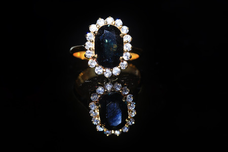 Jewellery diamond ring and gemstone on a black backgroundの写真素材