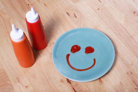 simple breakfast with smile face on dishの写真素材