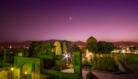 Panorama view over the roof's of Kashan by night with moonの写真素材
