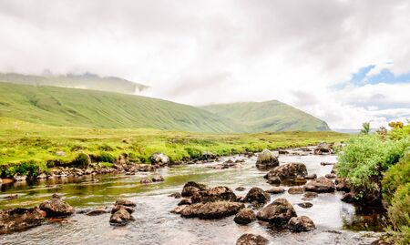 View on picturesque creek landscape in Scotlandの写真素材