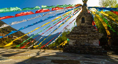 View on tibetan Stupa with colorful buddhist prayer flagsの写真素材