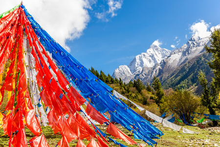 View on prayer flags before Siguniang mountain in Sichuan Province