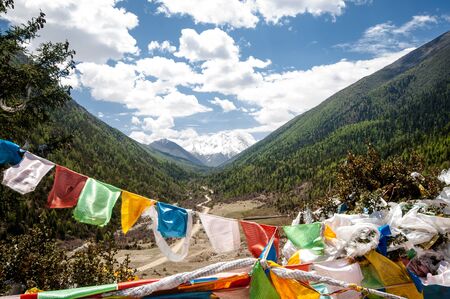 View on buddhist prayer flags in the tibetan higlands