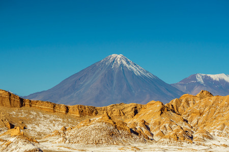 View on Volcano Licancabur at the border of Chile to Bolivia by San Pedro de Atacamaの写真素材