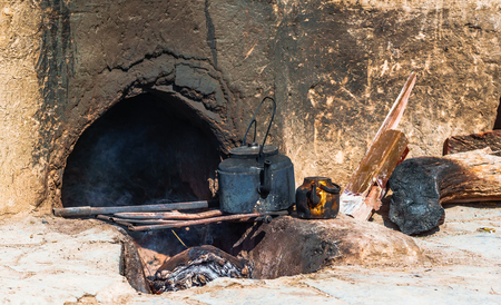 View on old iron kettle on fireplaceの写真素材