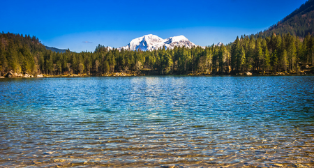 View on lake Hintersee with snowy mountains in the Alps by Berchtesgaden