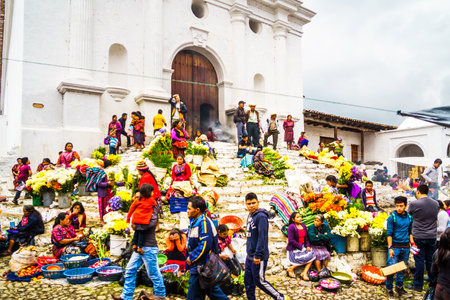 Chichicastenango, Guatemala on 2th May 2016: View on group of indigenous people selling products in front of churchのeditorial素材