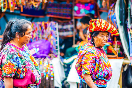 Chichicastenango, Guatemala on 2th May 2016: View on old woman wearing colorful clothes on maya market in Chichicatenangoのeditorial素材