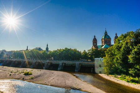 Isar and Sankt Lukas church in Munich. Bavaria, Germanyの写真素材