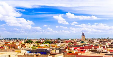 Cityscape of the roofs of Marrakech with a minaret, Moroccoの写真素材