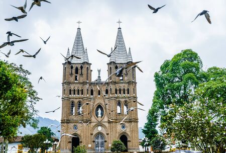 Church and main square in colonial city El Jardin, Colombia, South Americaの写真素材