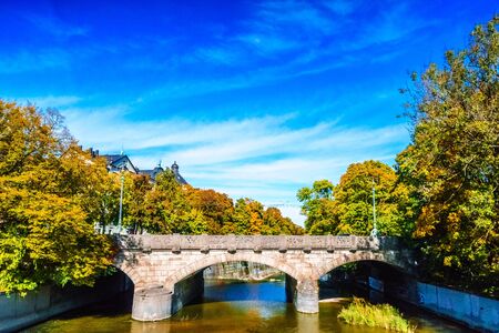 View on colorful trees n Autumn at the Isar in Munich