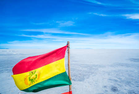 National flag of Bolivia on Uyuni sal lake, Bolivia. High quality photoの写真素材