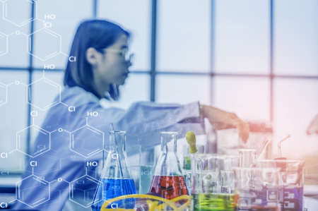 Female scientist Health care Working in chemistry lab, With colorful chemical bottles and tubes placed on the table, Sitting analyzing and busy with work. About cosmetic and beauty products.の写真素材