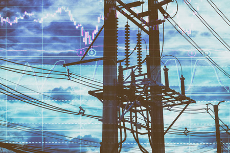 Electric pole, and sky stock chart as background. With the concept of volatility of stocks and energy businesses in the global market.の写真素材