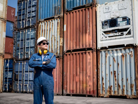 Businessmen ceo manager foreman engineering company wear blue safety hat white hold a screwdriver is...