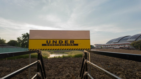 Warning sign construction safety danger build reconstruction industrail banner yellow caution security road traffic attention hazard risk mark exclamation beware problem warning alの写真素材